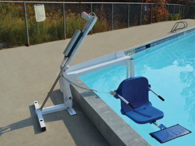ambassador pool lift, lowered in to a swimming pool, clearing the pool wall
